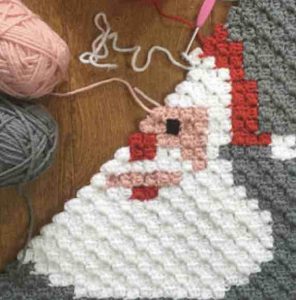 Tricoter une couverture père Noel