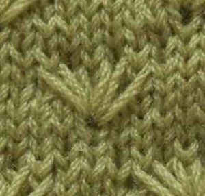 Points tricots aux aiguilles : fleur de pissenlit